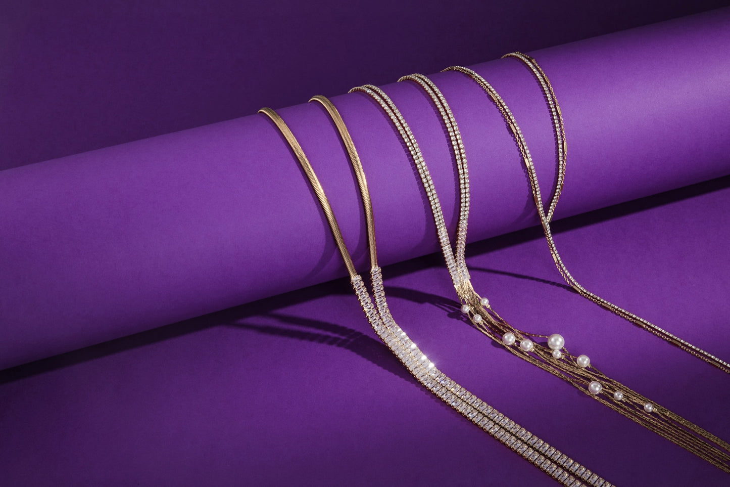 Gold crystal necklaces and pearl chain necklaces by Solre Jewelry